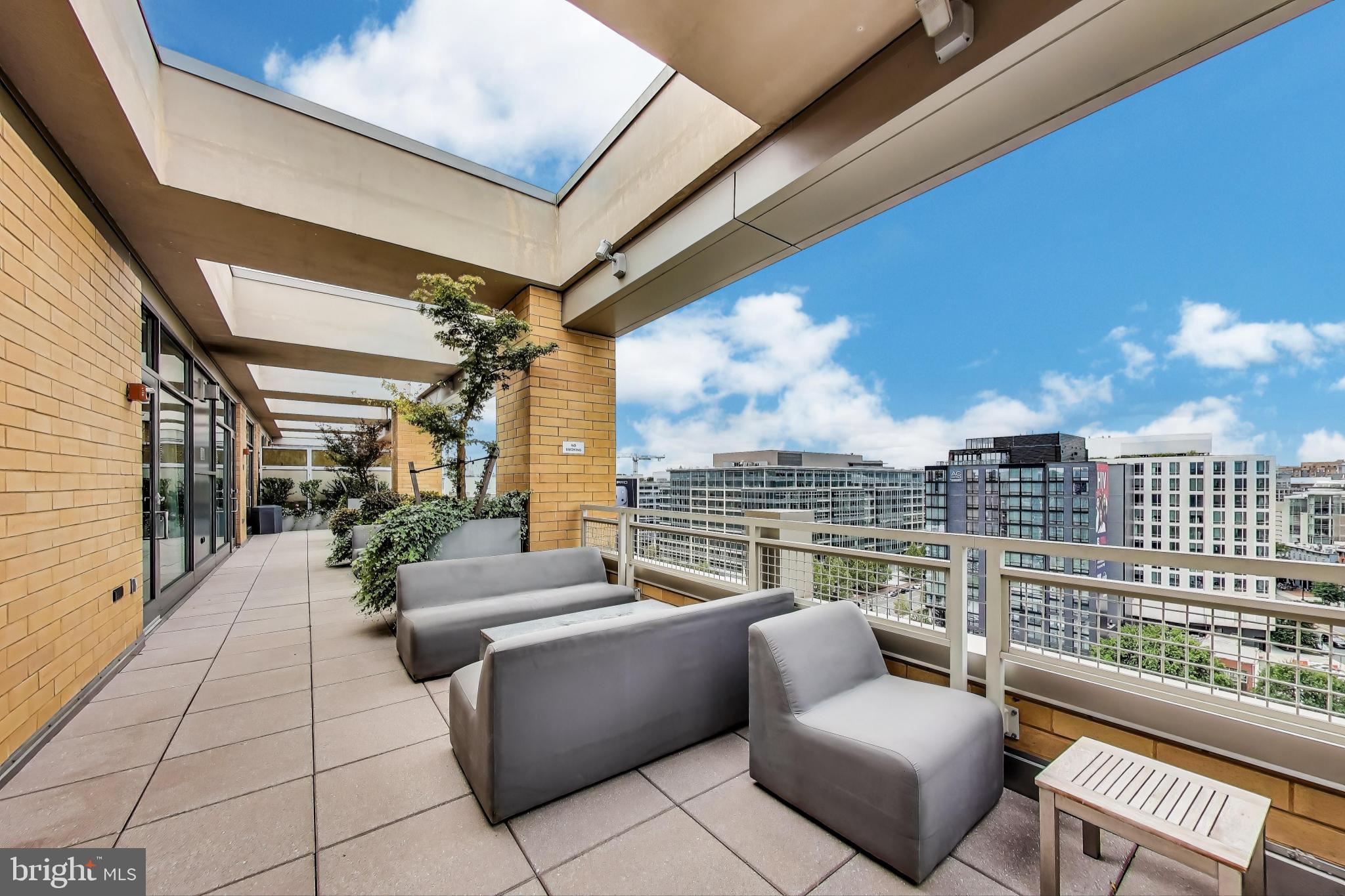 475 K Street Northwest, Unit 919 Washington, DC 20001 - Photo 30 of 43 a balcony with furniture and a potted plant
