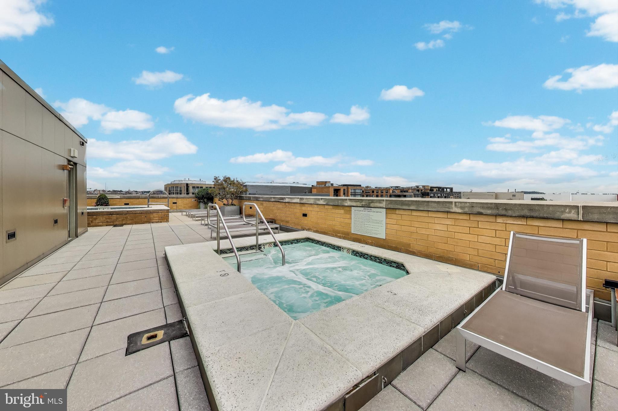 475 K Street Northwest, Unit 919 Washington, DC 20001 - Photo 32 of 43 a view of a terrace with outdoor seating and city view