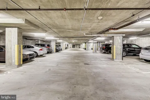 a view of parking garage with cars