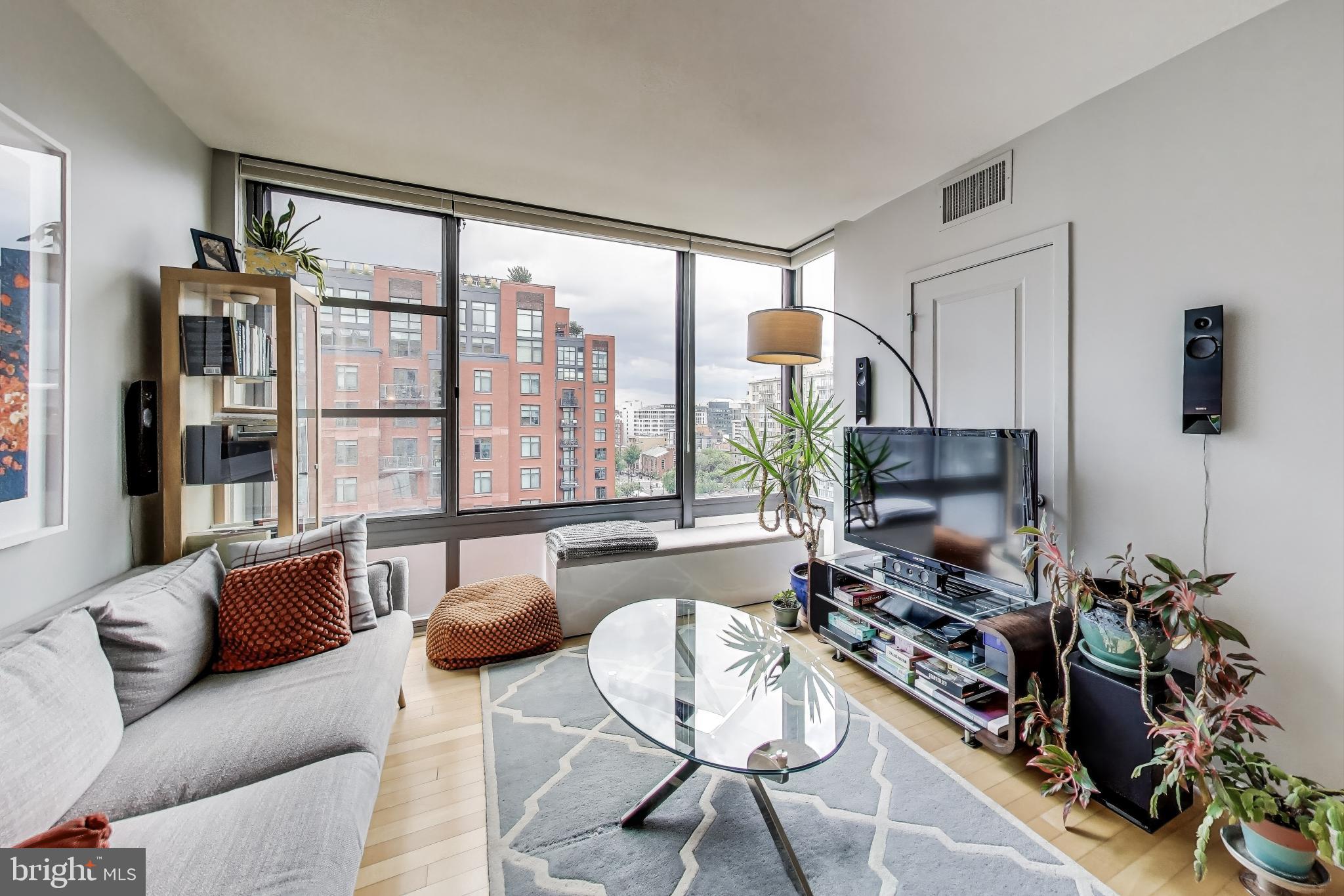 475 K Street Northwest, Unit 919 Washington, DC 20001 - Photo 5 of 43 a living room with furniture and a flat screen tv