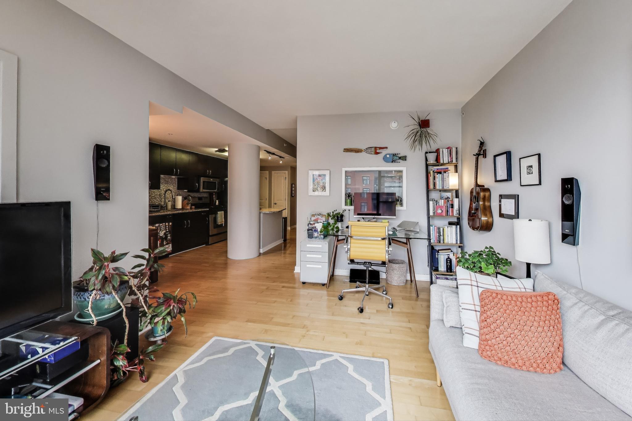 475 K Street Northwest, Unit 919 Washington, DC 20001 - Photo 6 of 43 a living room with patio furniture and a flat screen tv