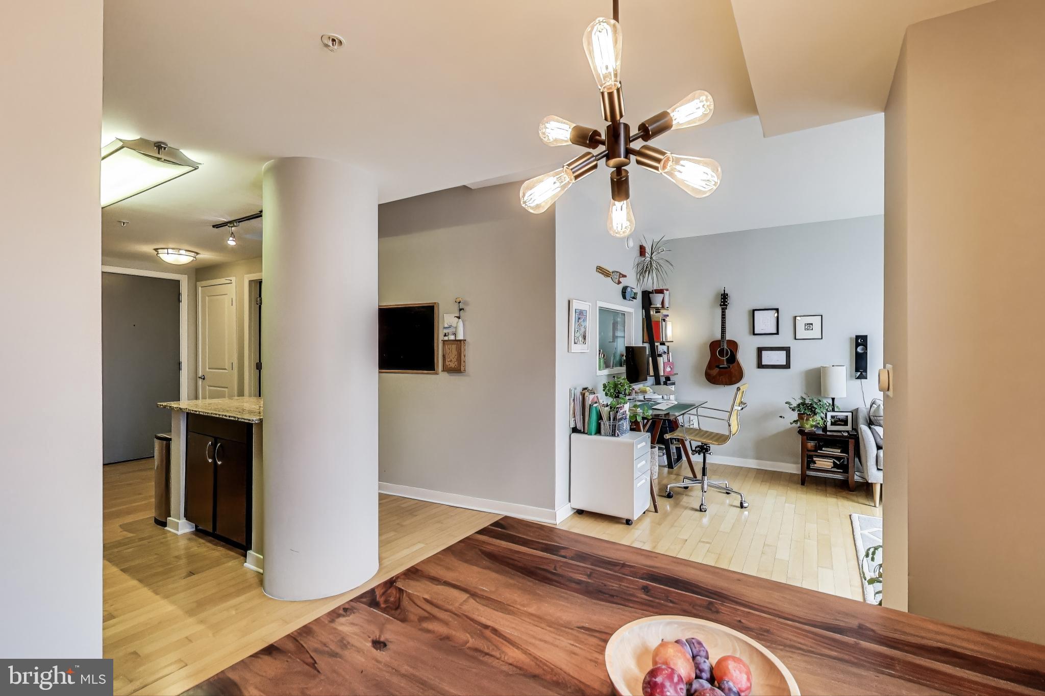 475 K Street Northwest, Unit 919 Washington, DC 20001 - Photo 9 of 43 a living room with furniture and a wooden floor