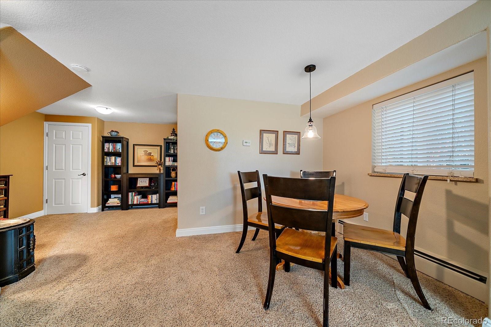 930 Reed Court Lakewood, CO 80214 - Photo 21 of 41 a view of a livingroom with furniture and a window
