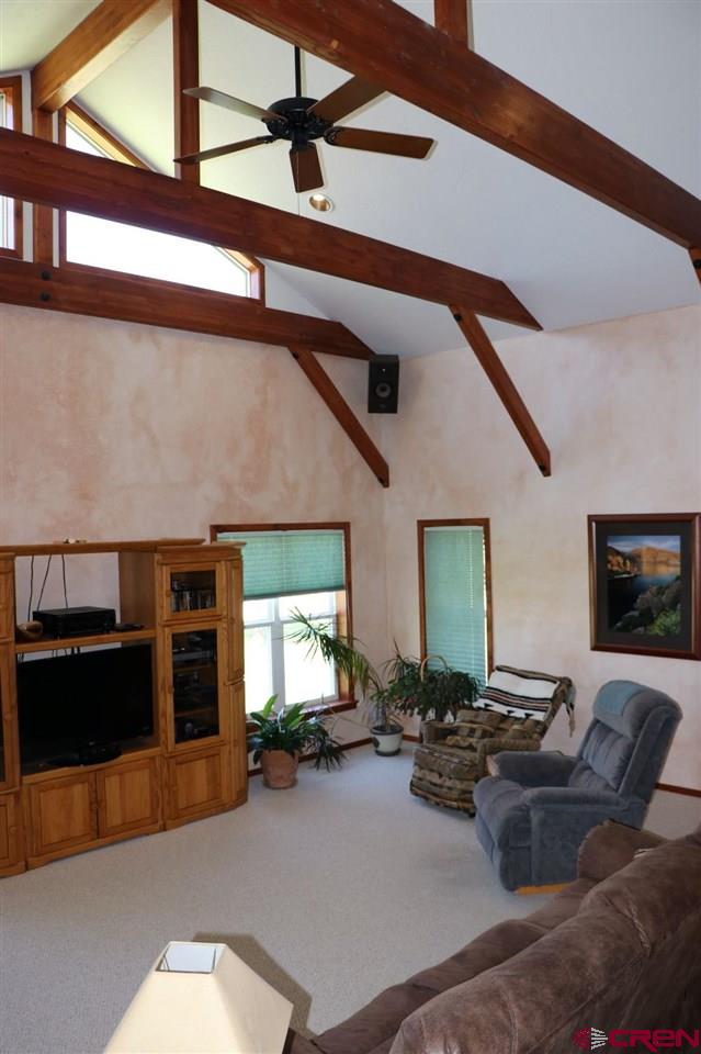 23720 County Rd M Cortez, CO 81321 - Photo 18 of 34 a living room with furniture and a flat screen tv