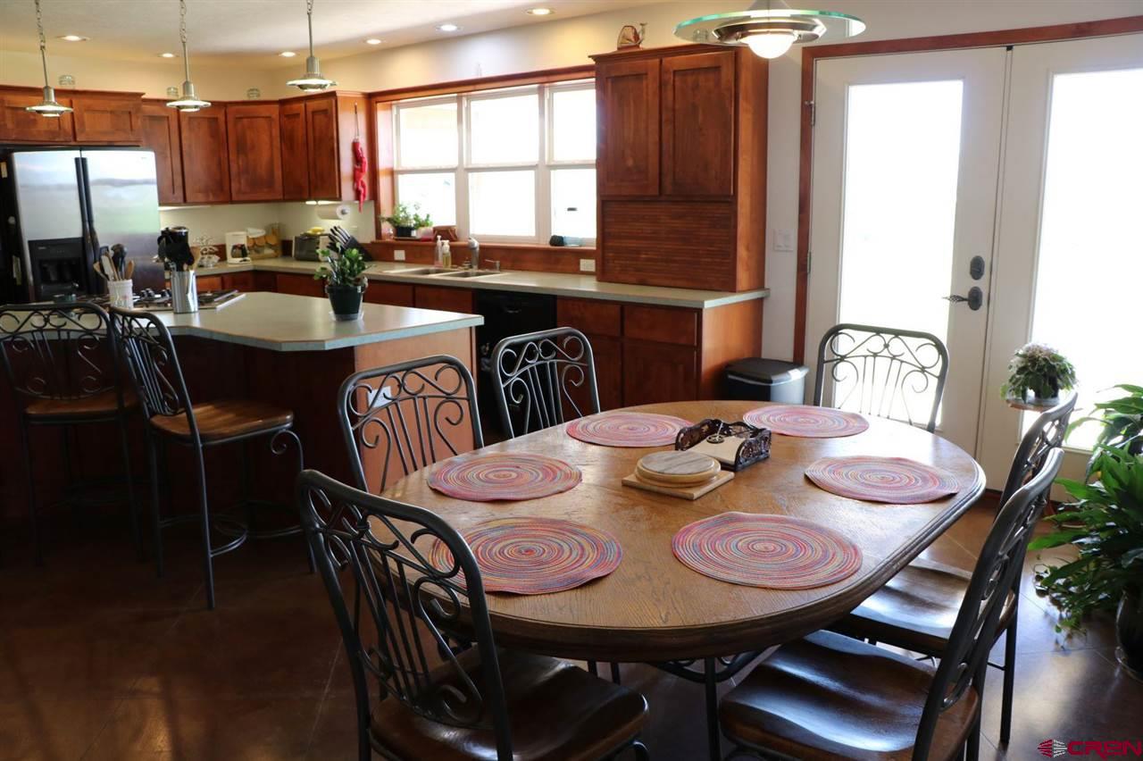 23720 County Rd M Cortez, CO 81321 - Photo 27 of 34 a view of a dining room with furniture