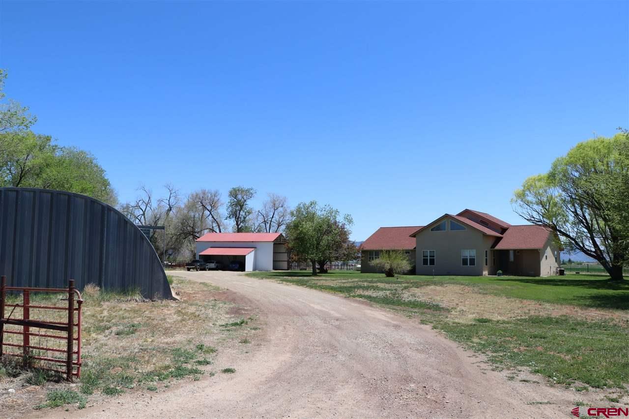 23720 County Rd M Cortez, CO 81321 - Photo 3 of 34 a house view with a garden space