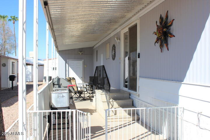 11425 East University Drive, Unit 63 Apache Junction, AZ 85120 - Photo 2 of 30 a view of a balcony and chairs