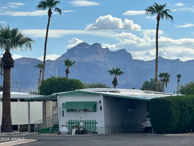 a living room with furniture a rug and a large window