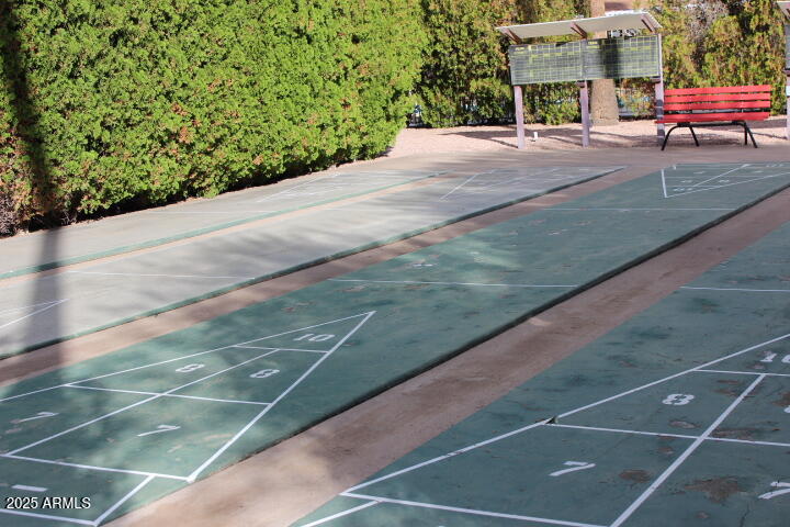 11425 East University Drive, Unit 63 Apache Junction, AZ 85120 - Photo 28 of 30 a view of a tennis ground with a large building in the background