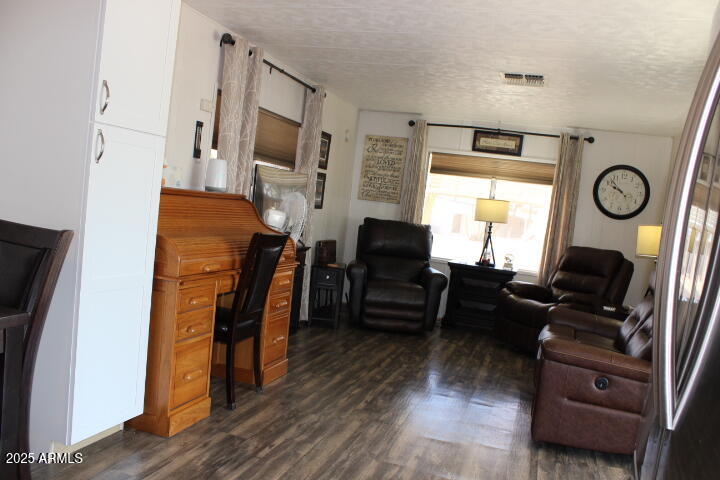 11425 East University Drive, Unit 63 Apache Junction, AZ 85120 - Photo 3 of 30 a living room with furniture and a fireplace