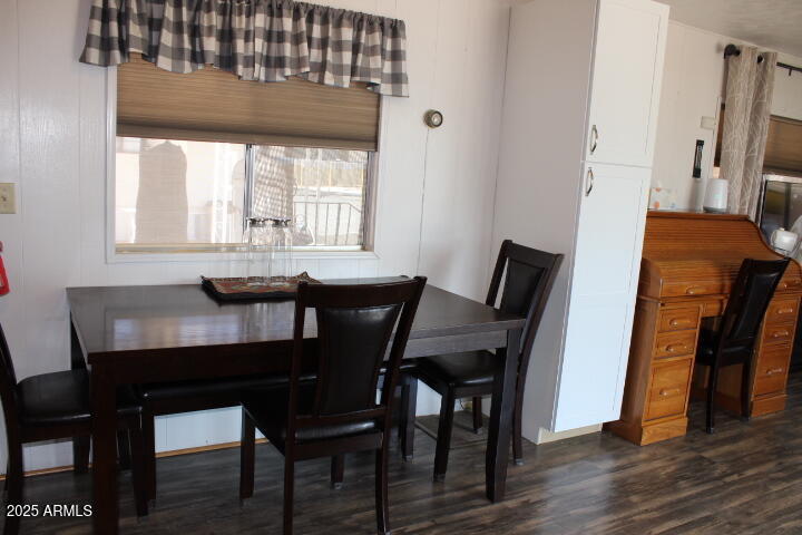 11425 East University Drive, Unit 63 Apache Junction, AZ 85120 - Photo 6 of 30 a dining room with furniture and window