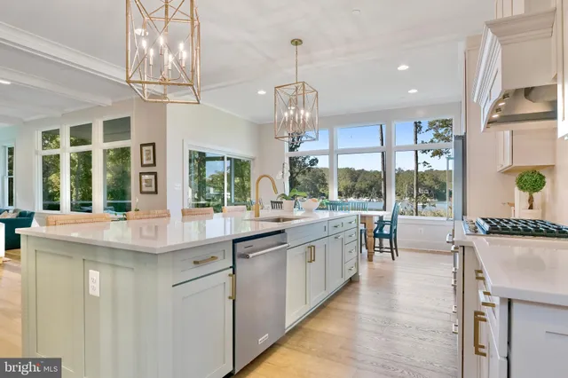 a kitchen with counter top space and living room