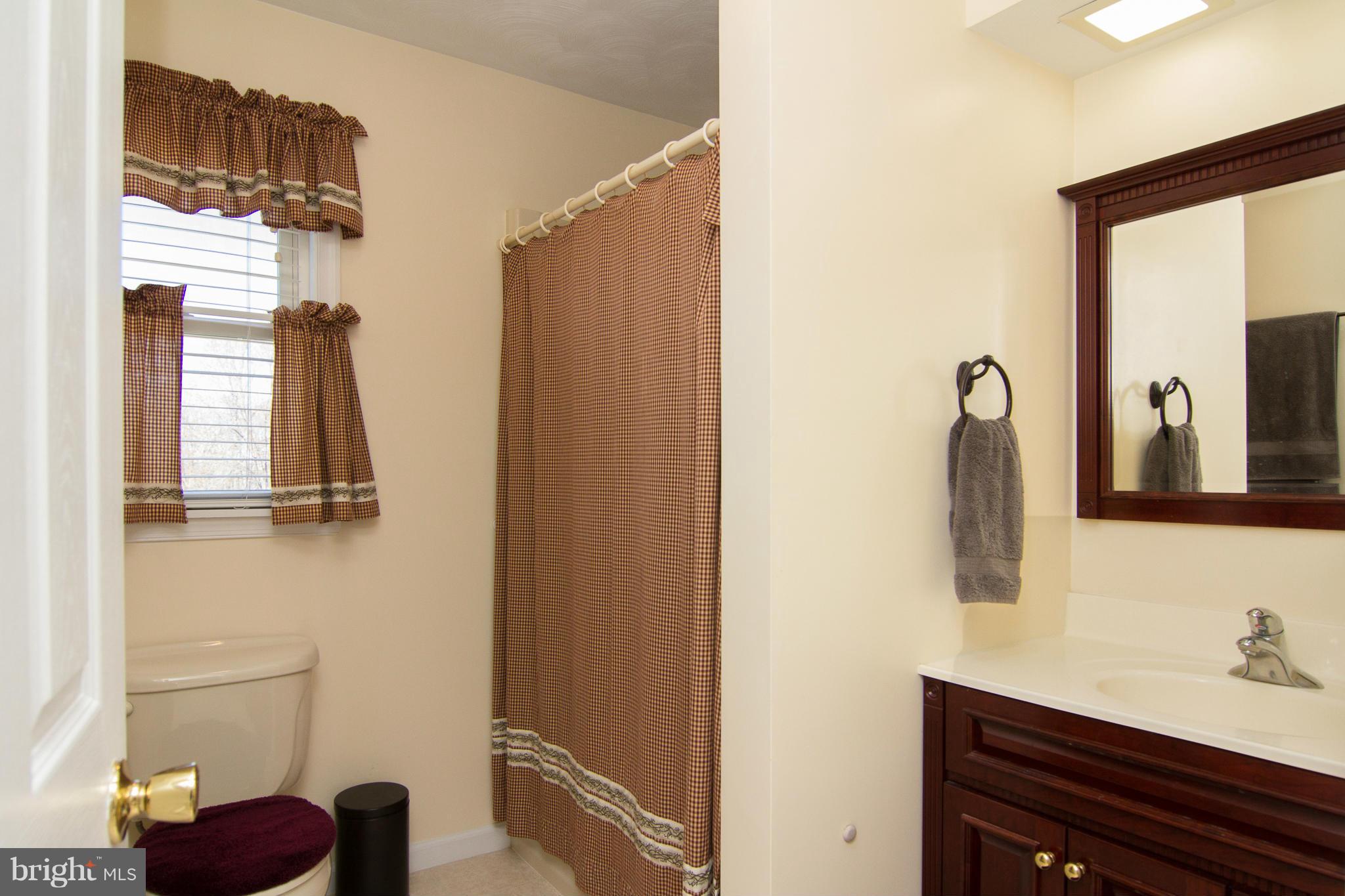 3773 Baptist Road Taneytown, MD 21787 - Photo 18 of 30 a bathroom with a sink and mirror