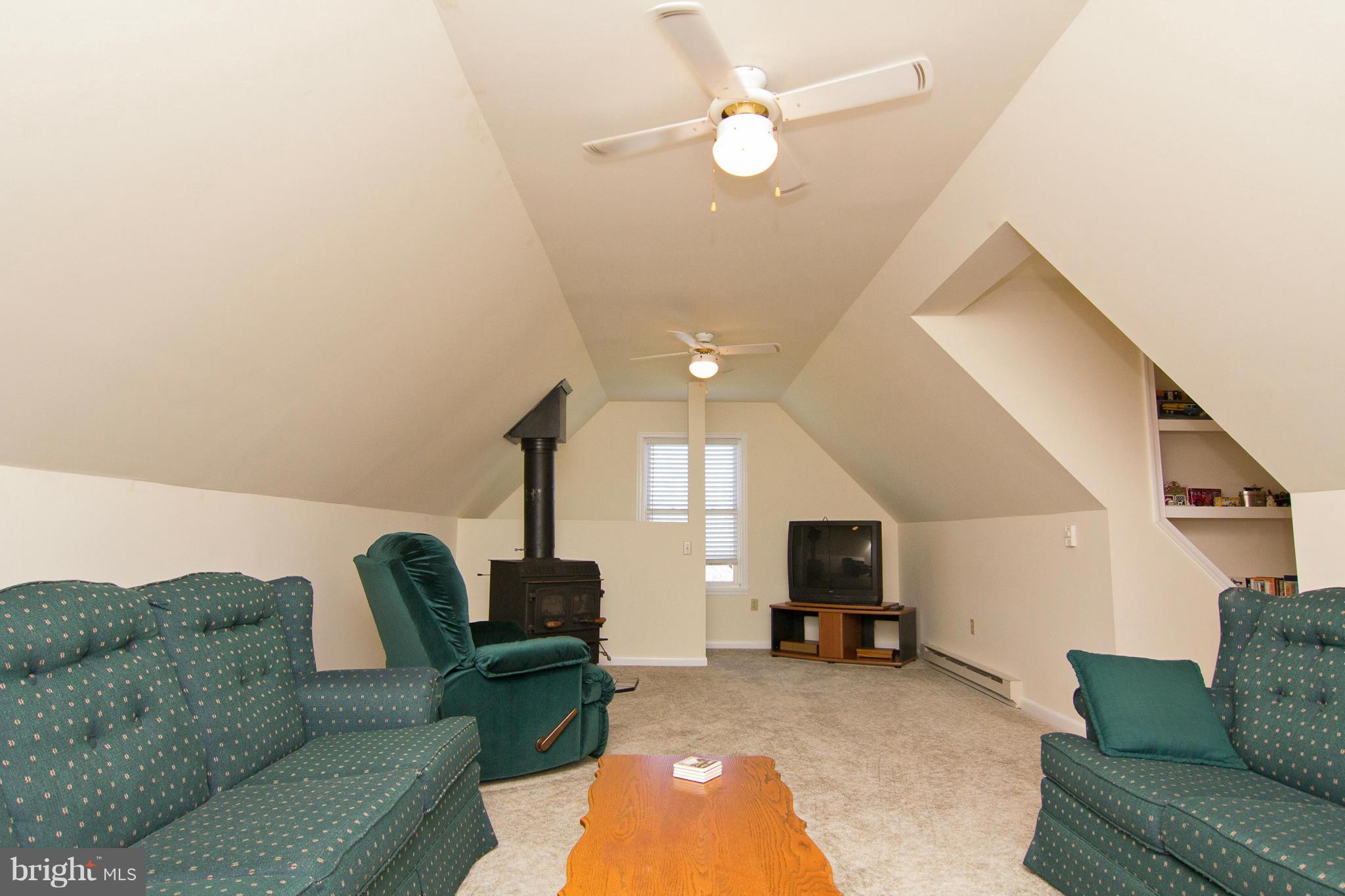 3773 Baptist Road Taneytown, MD 21787 - Photo 21 of 30 a living room with furniture and a flat screen tv
