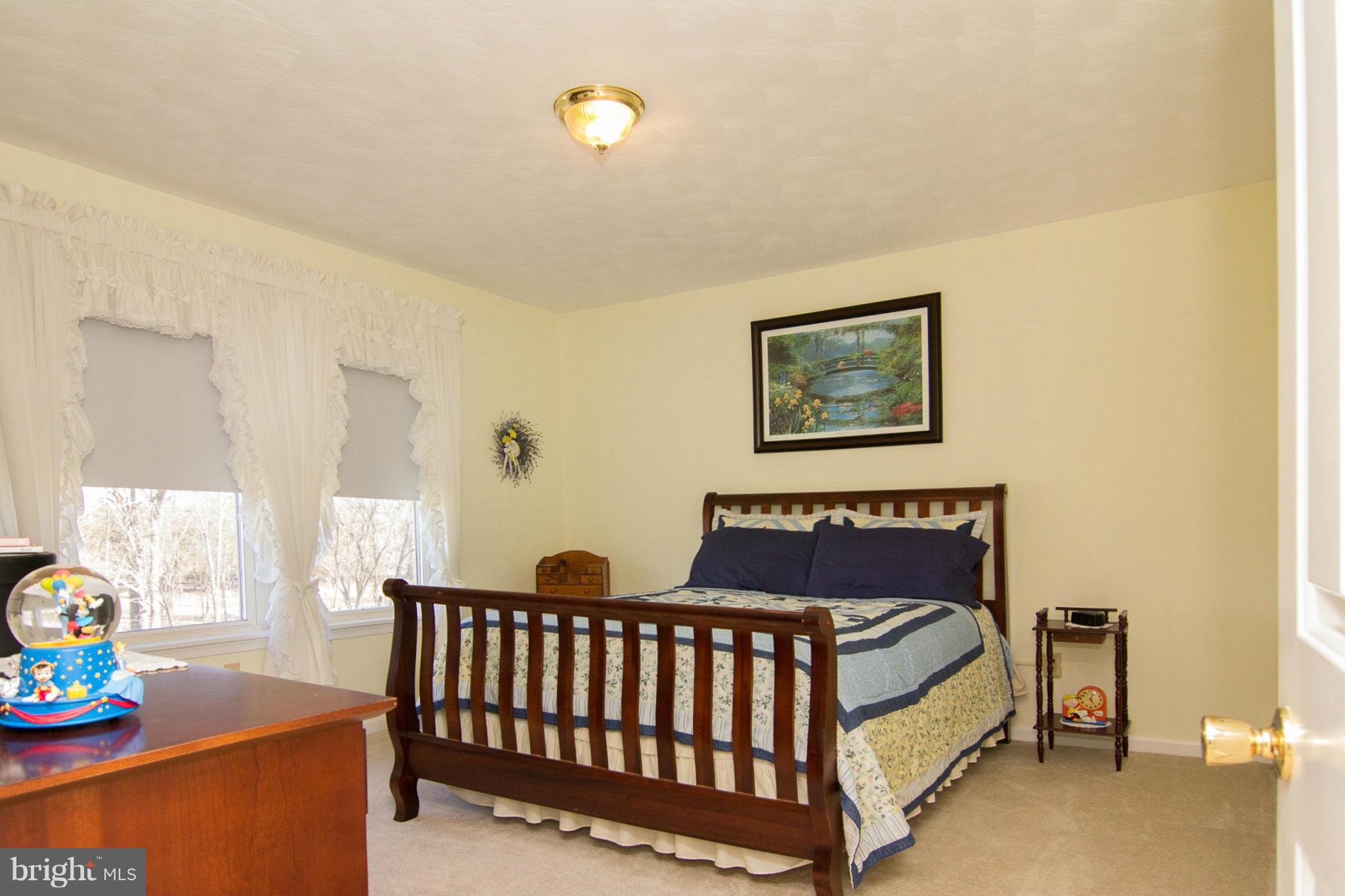 3773 Baptist Road Taneytown, MD 21787 - Photo 9 of 30 a bedroom with furniture and a window