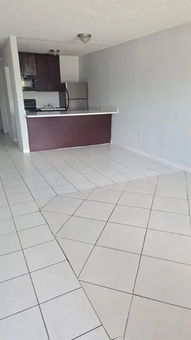 a kitchen with stainless steel appliances a sink and cabinets