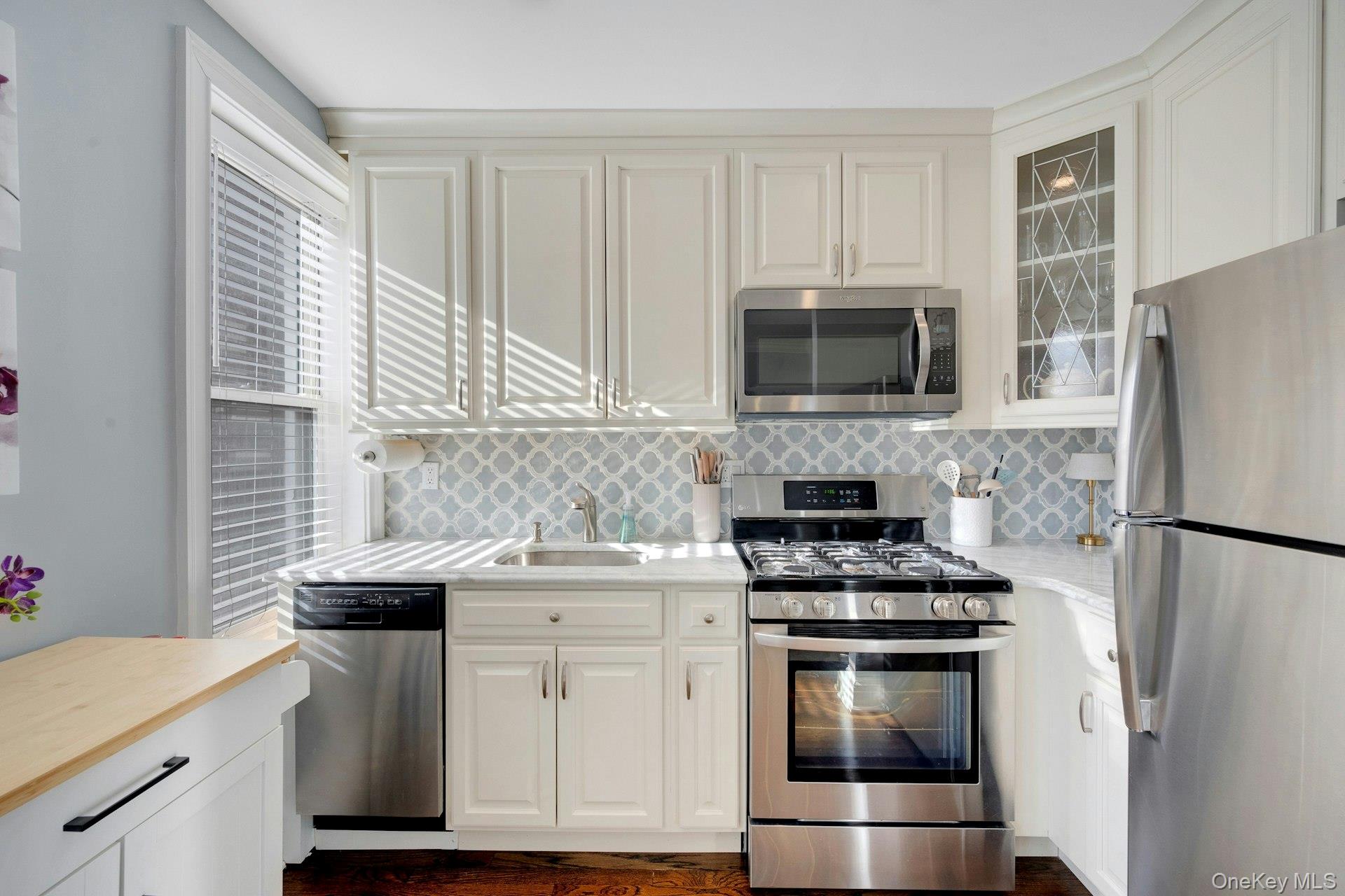 280 Bronxville Road, Unit 3W Bronxville, NY 10708 - Photo 12 of 19 a kitchen with appliances a sink and a counter top space