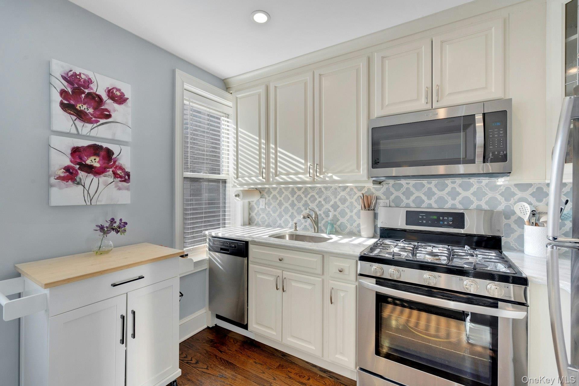 280 Bronxville Road, Unit 3W Bronxville, NY 10708 - Photo 13 of 19 a kitchen with cabinets appliances and a window