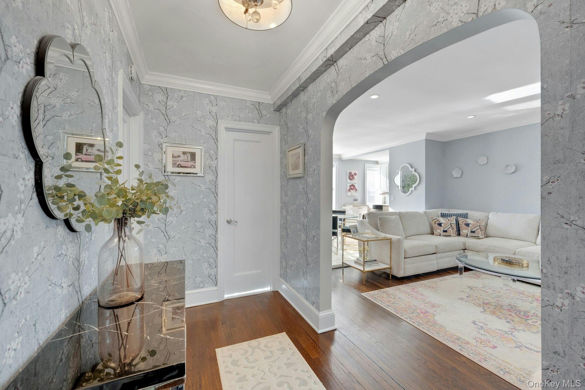 280 Bronxville Road, Unit 3W Bronxville, NY 10708 - Photo 4 of 19 a living room with furniture and a chandelier