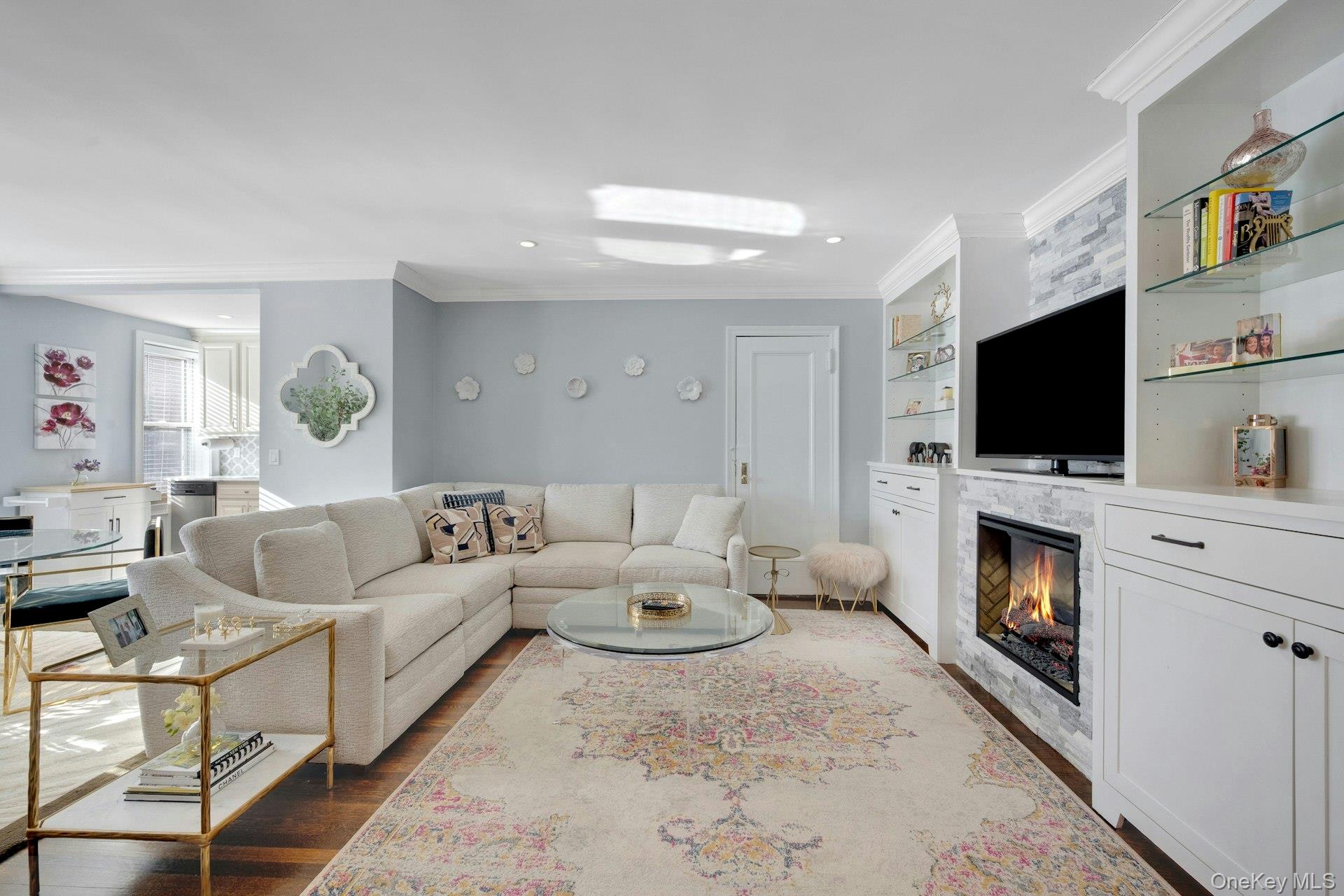 280 Bronxville Road, Unit 3W Bronxville, NY 10708 - Photo 5 of 19 a living room with furniture a fireplace and a flat screen tv