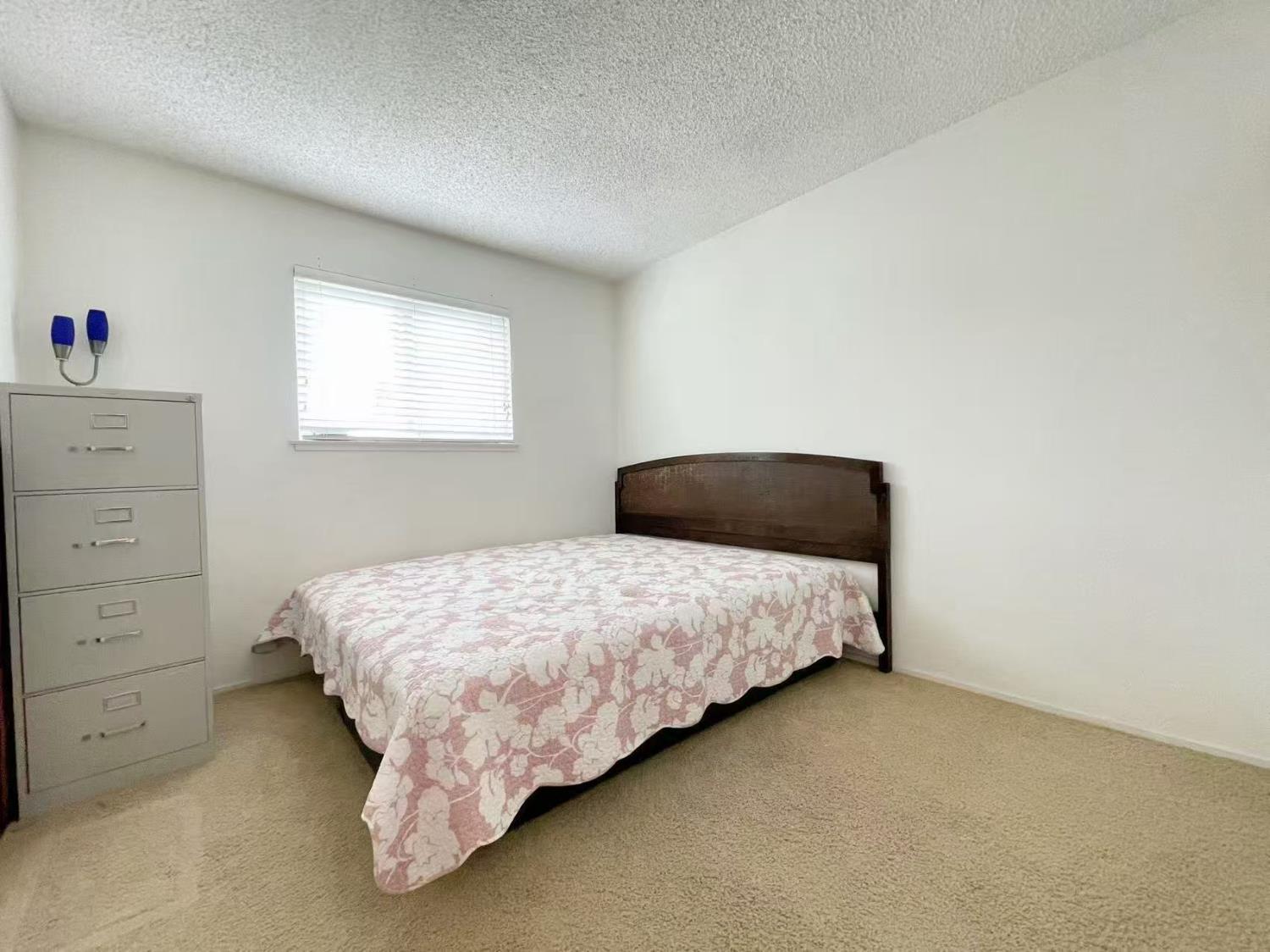 4016 Knoll Top Court Carmichael, CA 95608 - Photo 14 of 33 a bedroom with a bed and window