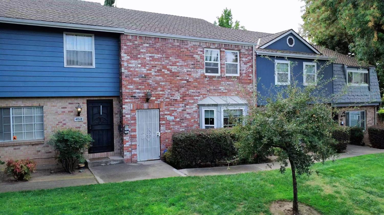 4016 Knoll Top Court Carmichael, CA 95608 - Photo 2 of 33 a front view of a house with a garden and plants