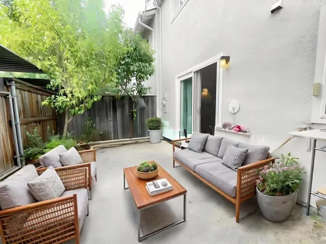 a outdoor living space with furniture and a potted plant