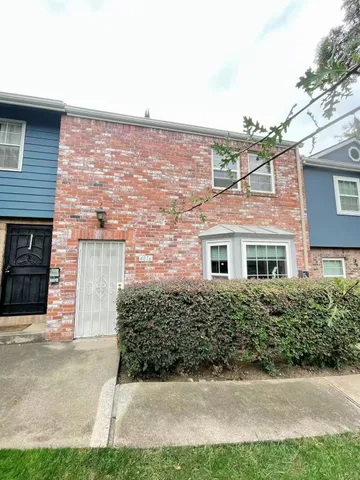 a view of a park with large trees