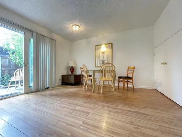 a view of a livingroom with furniture and wooden floor