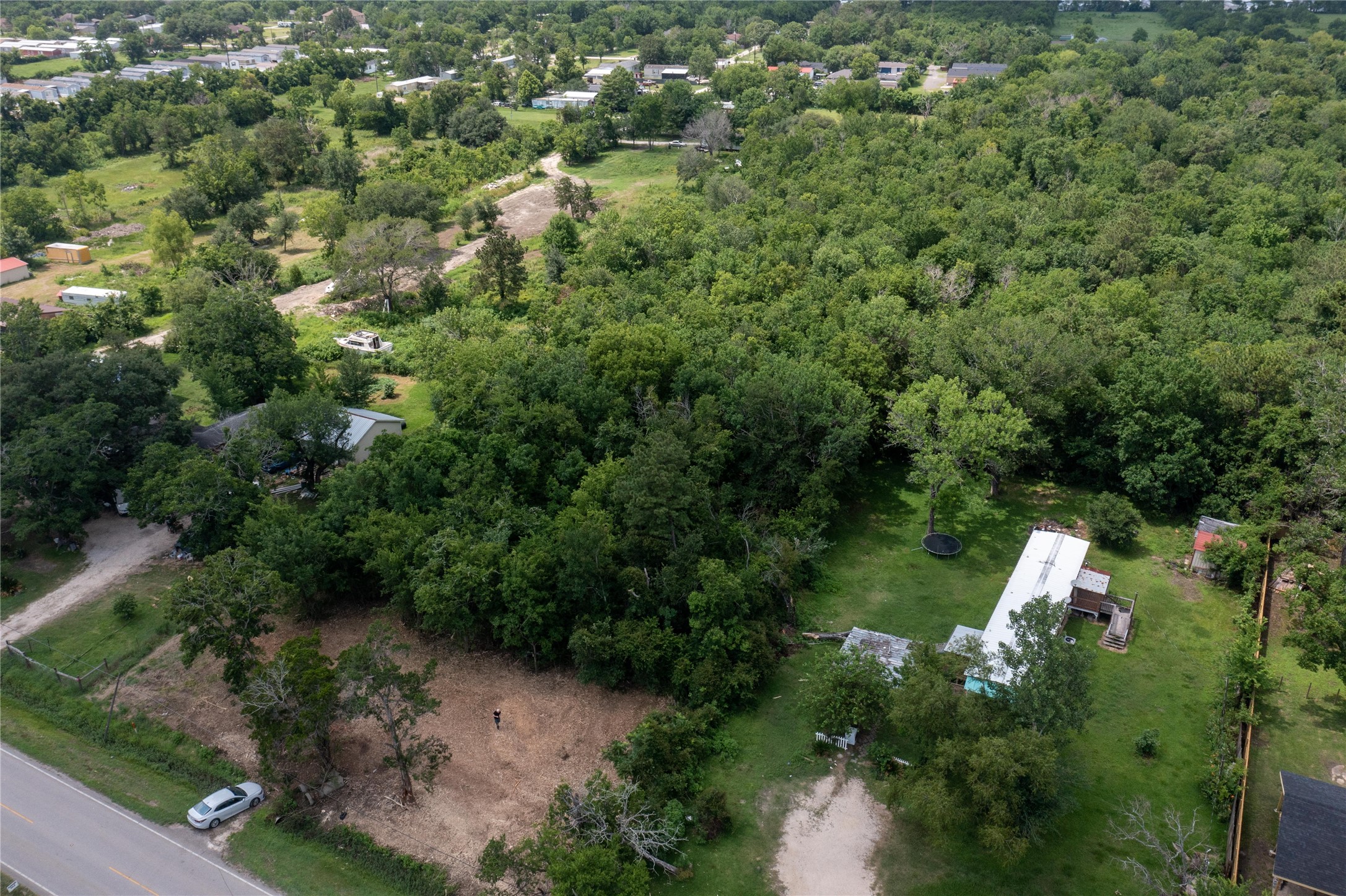 3902 West Cedar Bayou Lynchburg Road Baytown, TX 77521 - Photo 11 of 17 an aerial view of a house with a yard and lake view