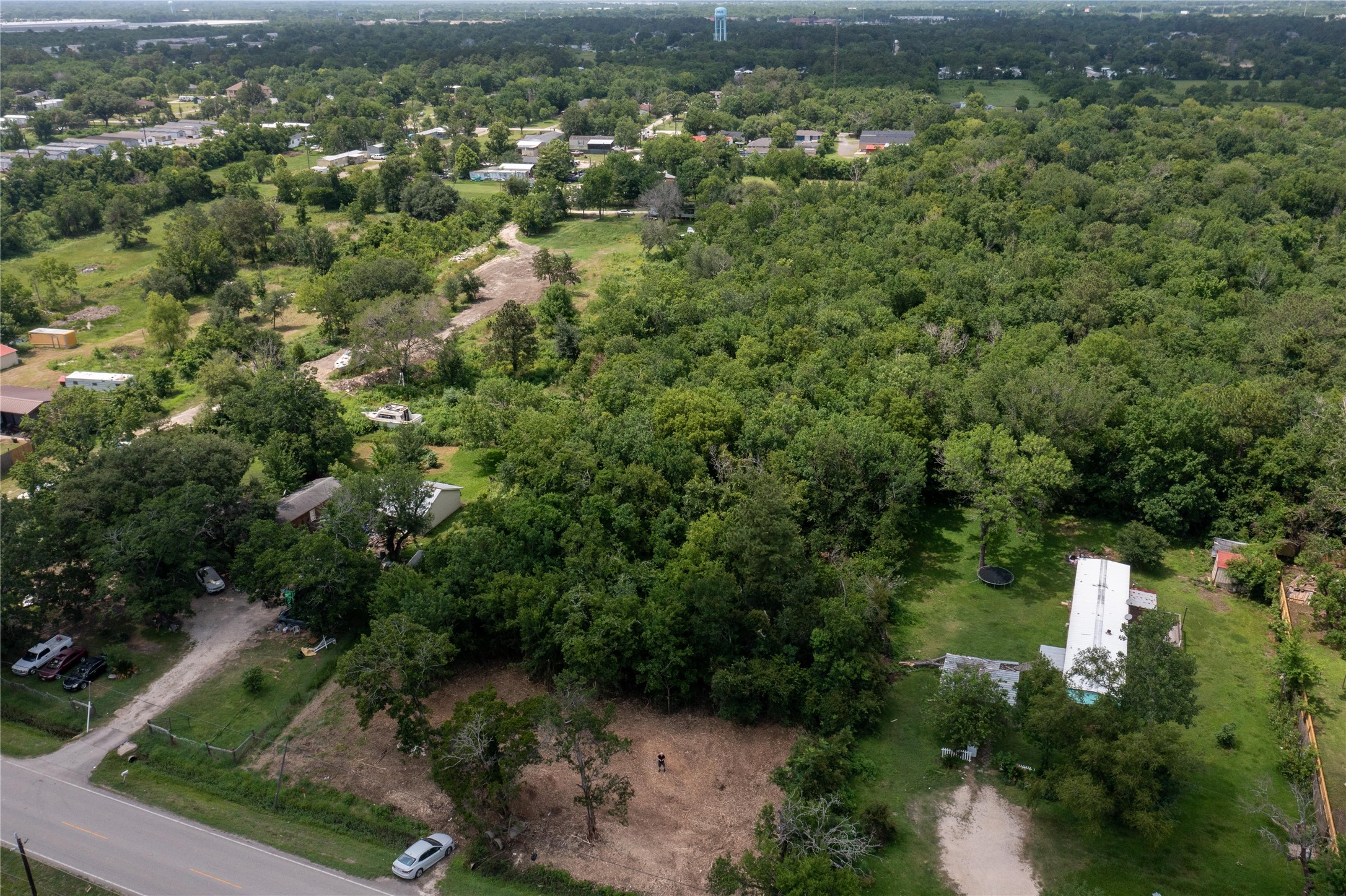 3902 West Cedar Bayou Lynchburg Road Baytown, TX 77521 - Photo 12 of 17 an aerial view of residential house with outdoor space and trees all around
