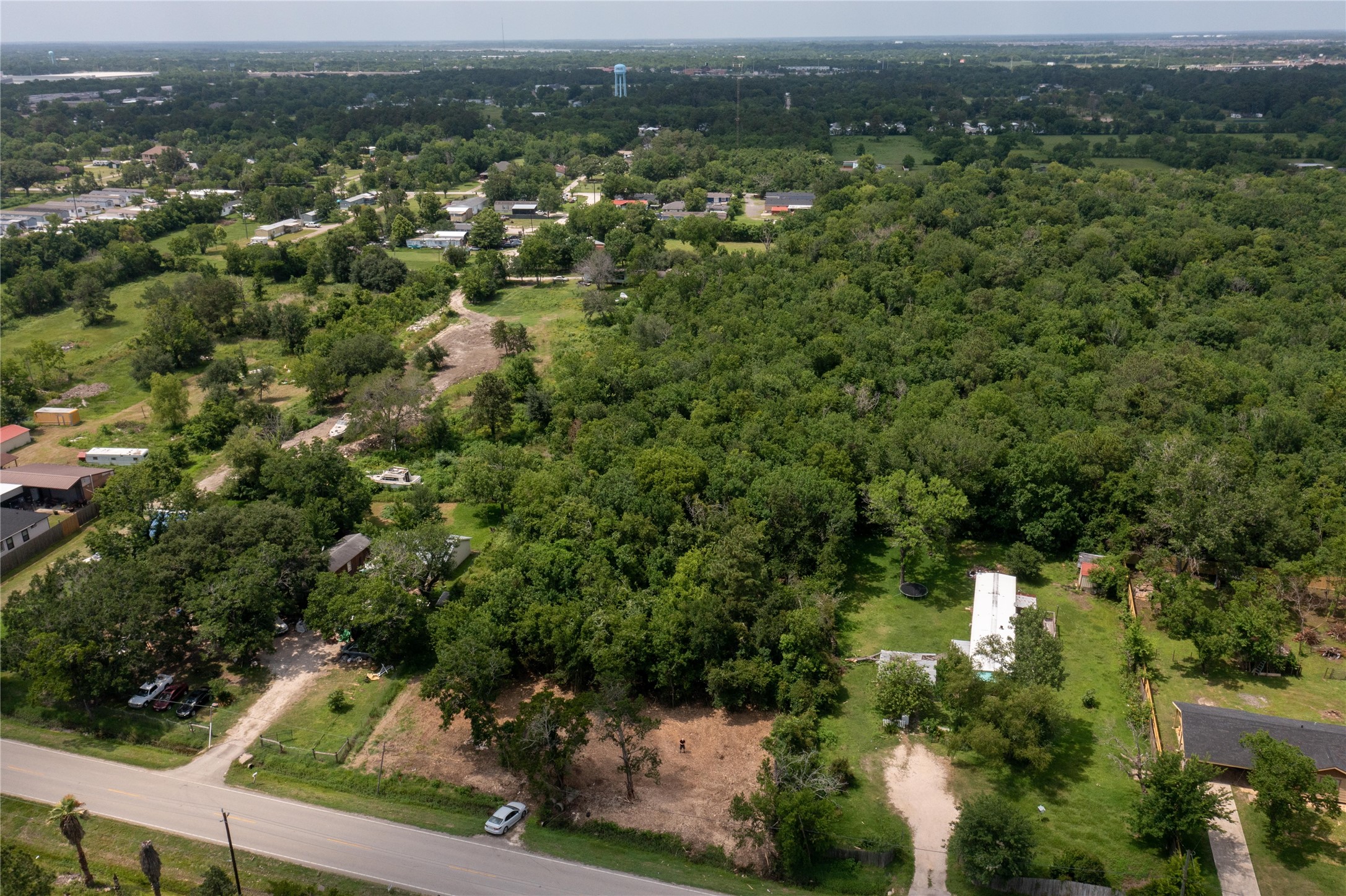 3902 West Cedar Bayou Lynchburg Road Baytown, TX 77521 - Photo 13 of 17 an aerial view of residential houses with outdoor space and trees