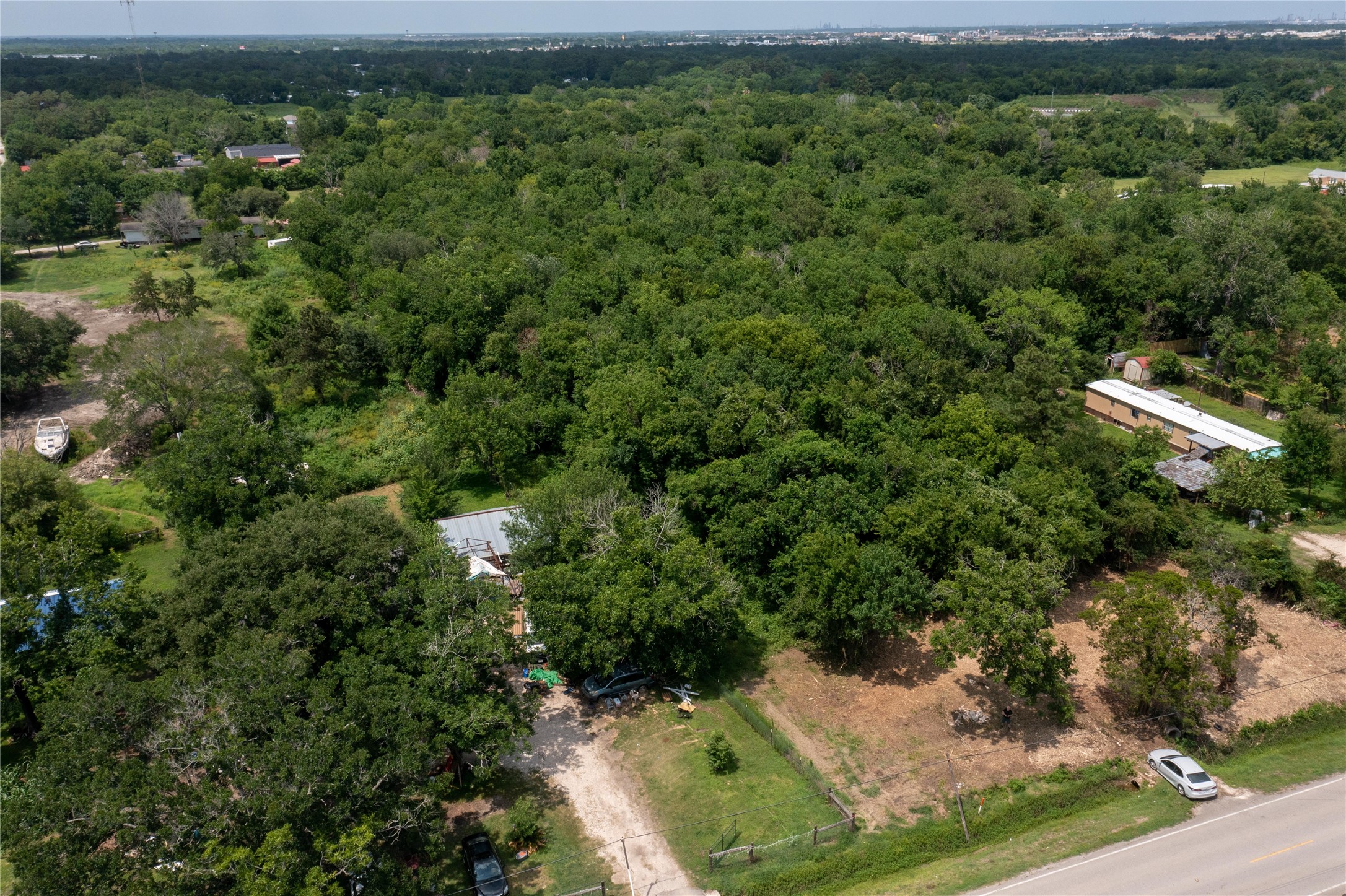 3902 West Cedar Bayou Lynchburg Road Baytown, TX 77521 - Photo 14 of 17 an aerial view of a house with a yard