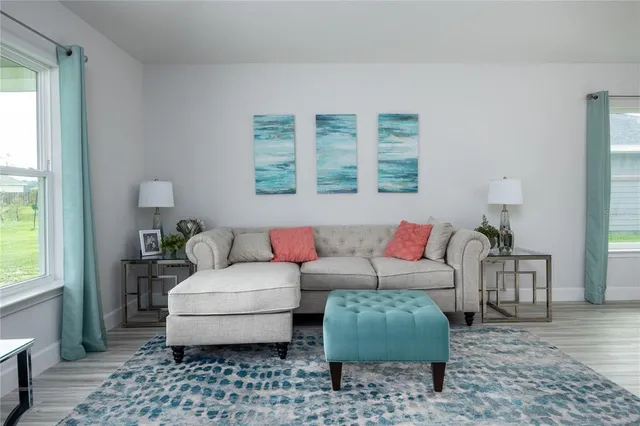 a living room with furniture and a window