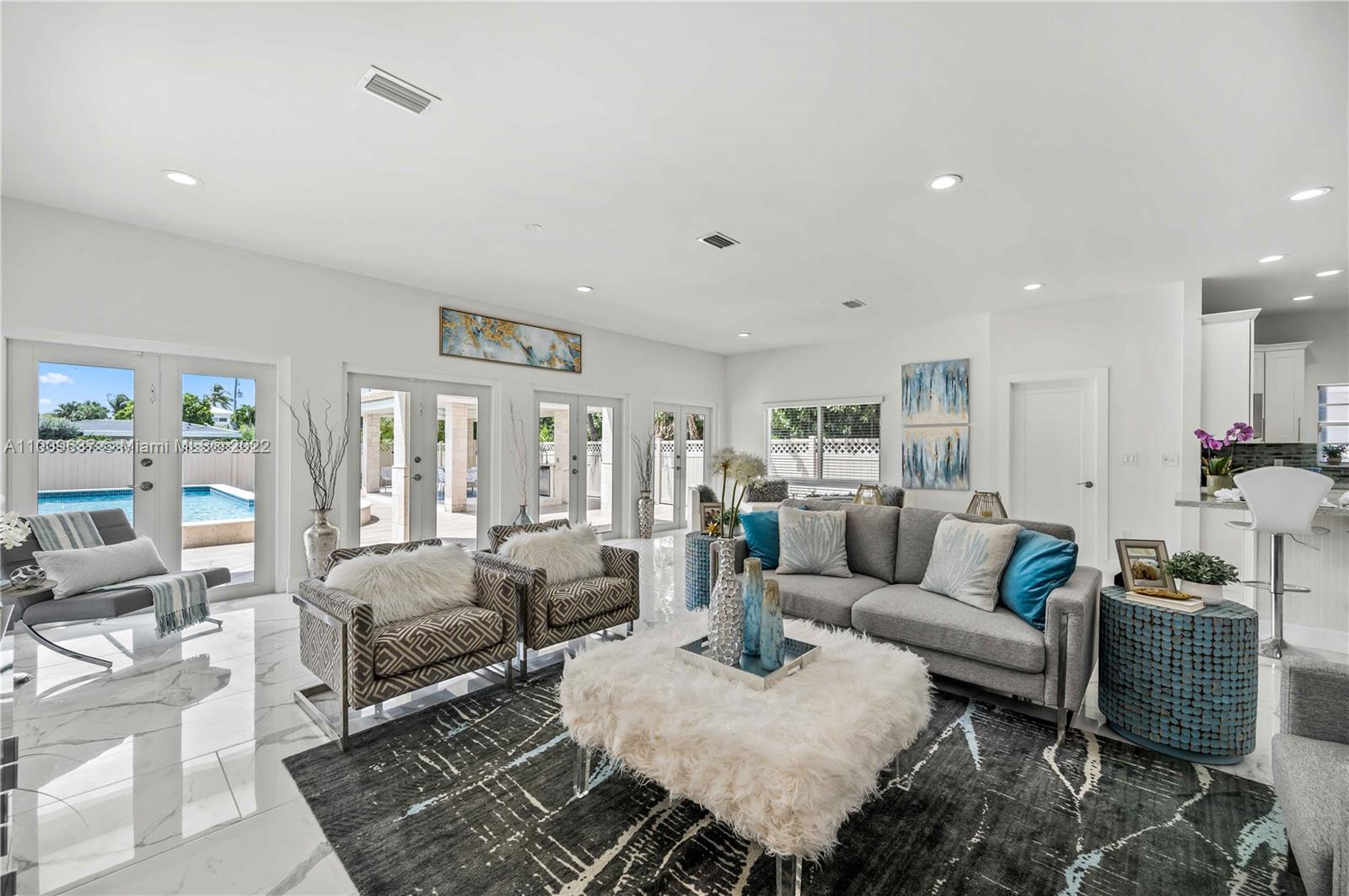 1700 Cleveland Road Miami Beach, FL 33141 - Photo 14 of 60 a living room with furniture and a large window