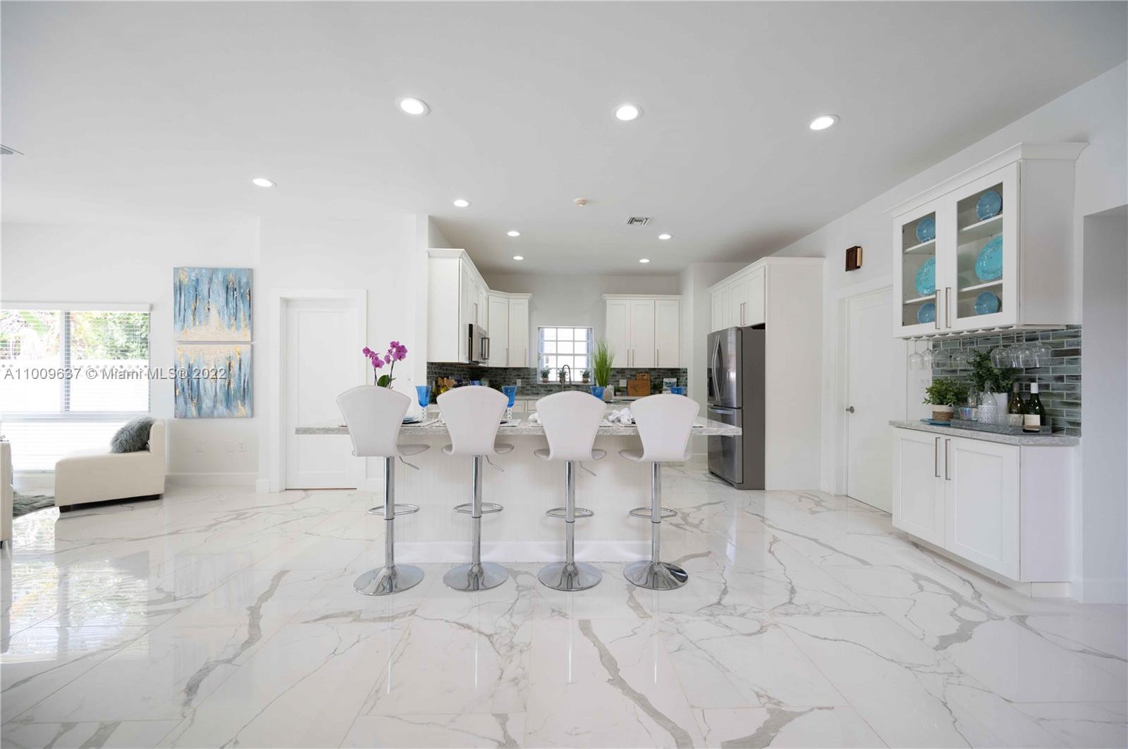 1700 Cleveland Road Miami Beach, FL 33141 - Photo 22 of 60 a living room with furniture and a large window