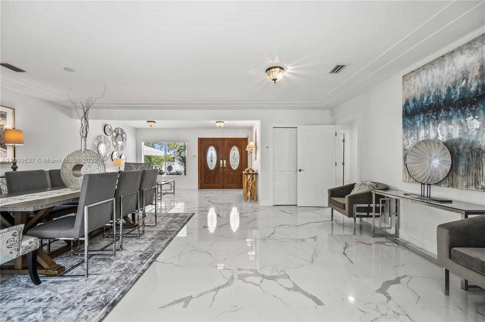 1700 Cleveland Road Miami Beach, FL 33141 - Photo 27 of 60 a living room with furniture a window and a table