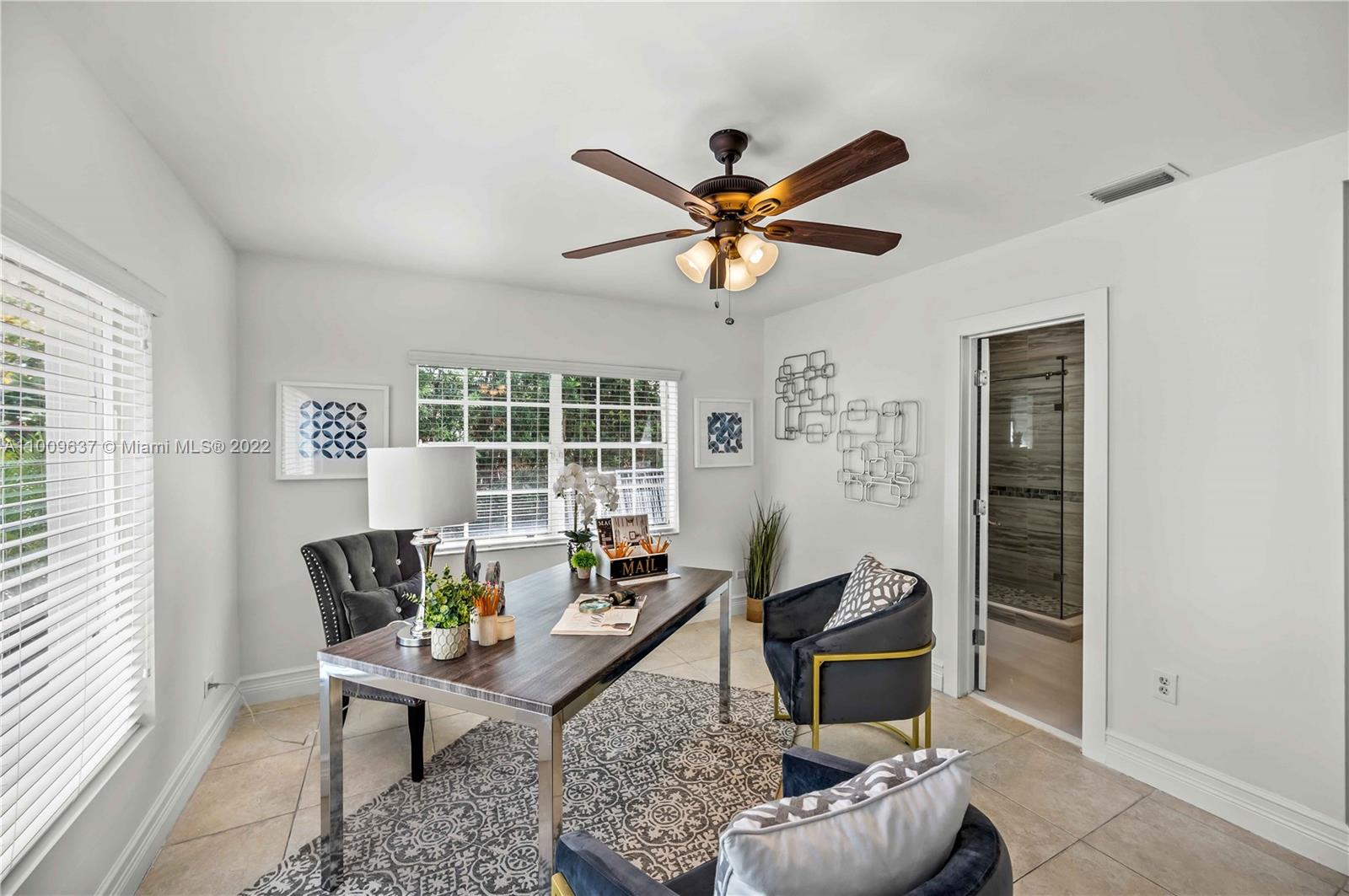 1700 Cleveland Road Miami Beach, FL 33141 - Photo 29 of 60 a living room with furniture and a window