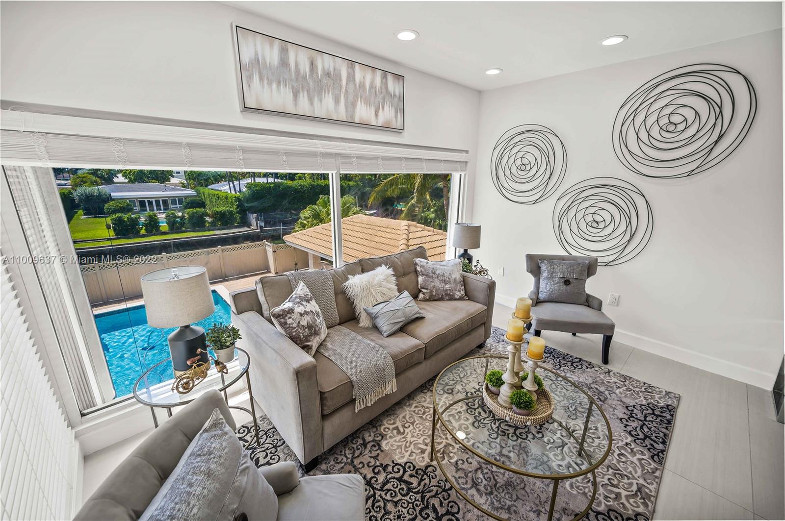 1700 Cleveland Road Miami Beach, FL 33141 - Photo 33 of 60 a living room with furniture and a large window