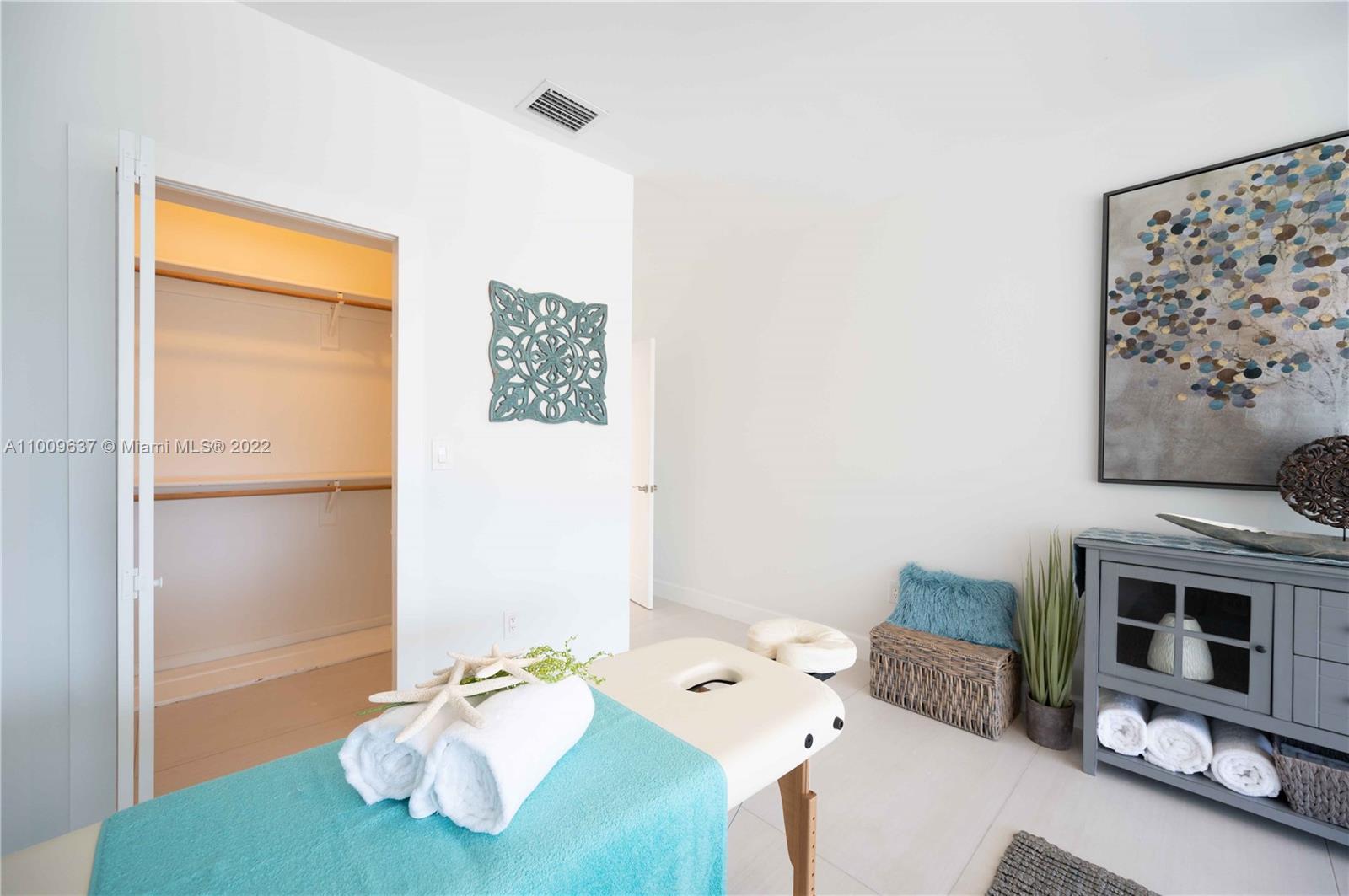 1700 Cleveland Road Miami Beach, FL 33141 - Photo 38 of 60 a view of a bedroom with furniture and a window