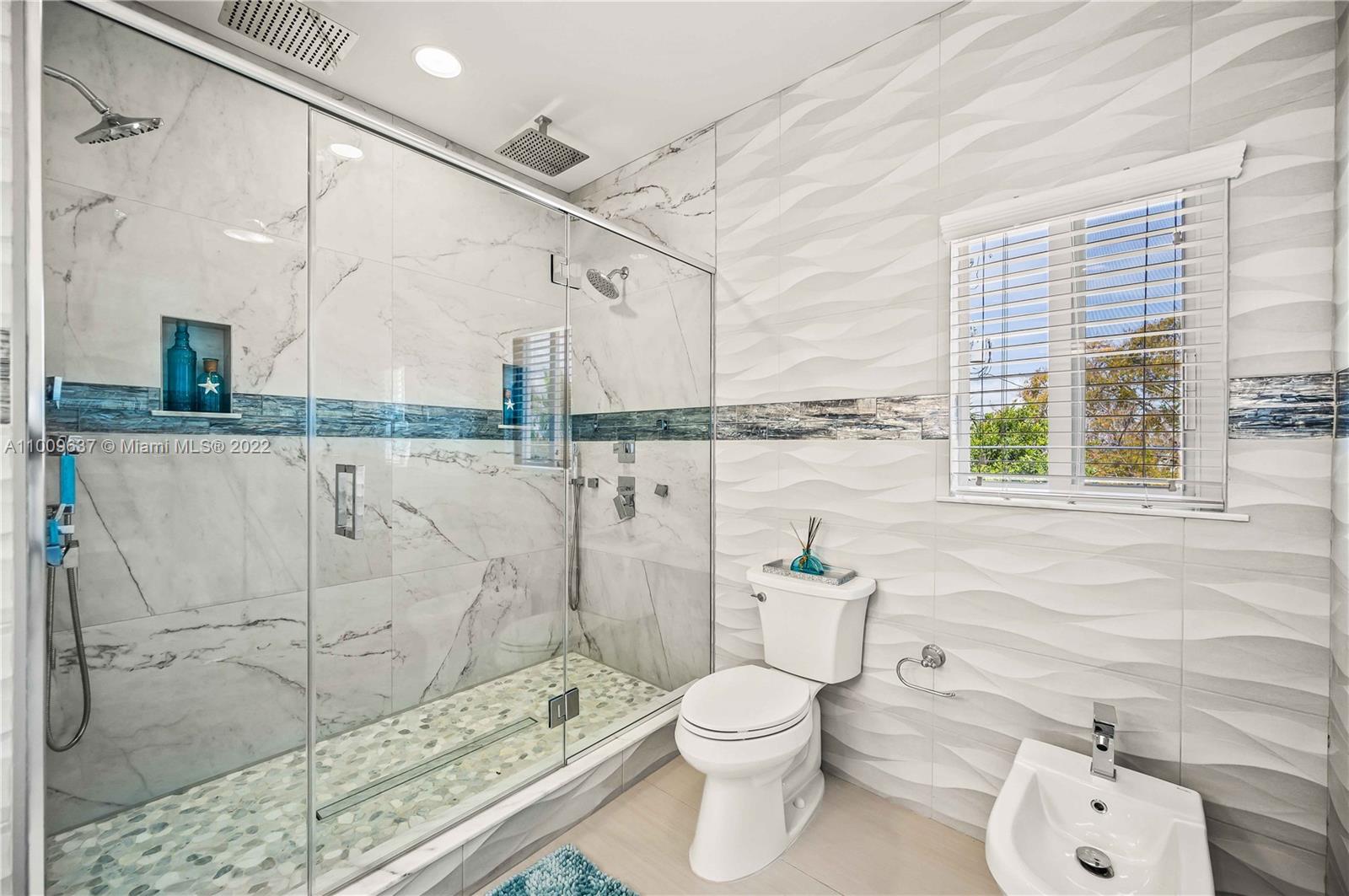 1700 Cleveland Road Miami Beach, FL 33141 - Photo 43 of 60 a bathroom with a toilet sink and shower