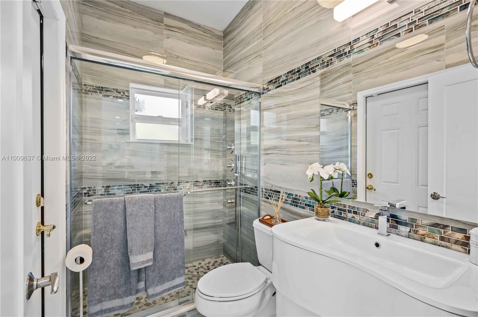 1700 Cleveland Road Miami Beach, FL 33141 - Photo 44 of 60 a bathroom with a sink toilet and shower