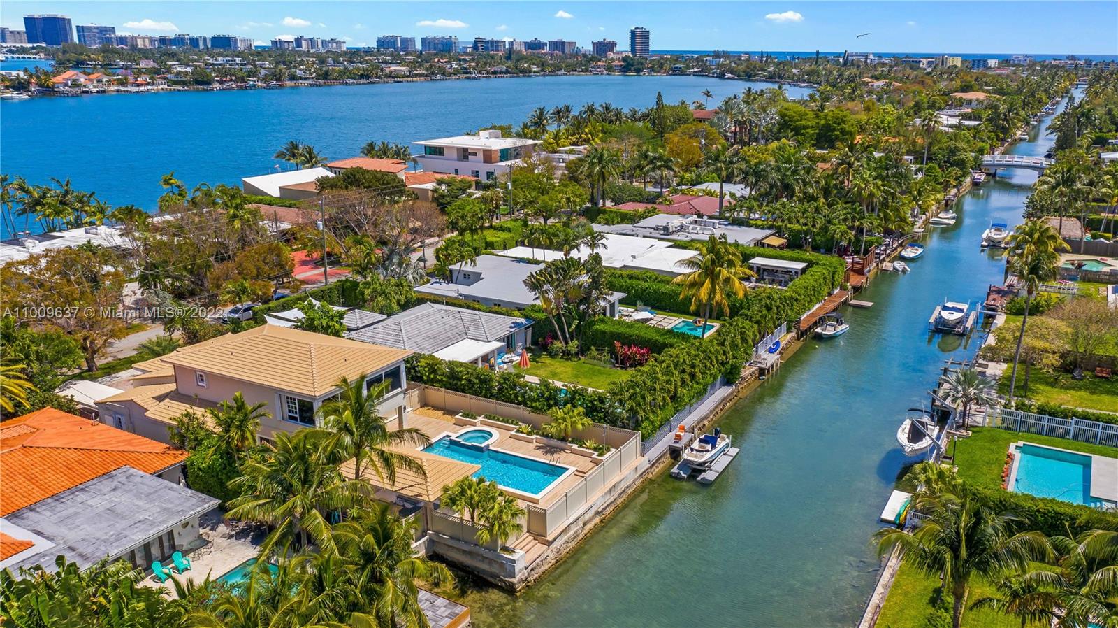 1700 Cleveland Road Miami Beach, FL 33141 - Photo 57 of 60 an aerial view of a city with lots of residential buildings ocean and mountain view in back