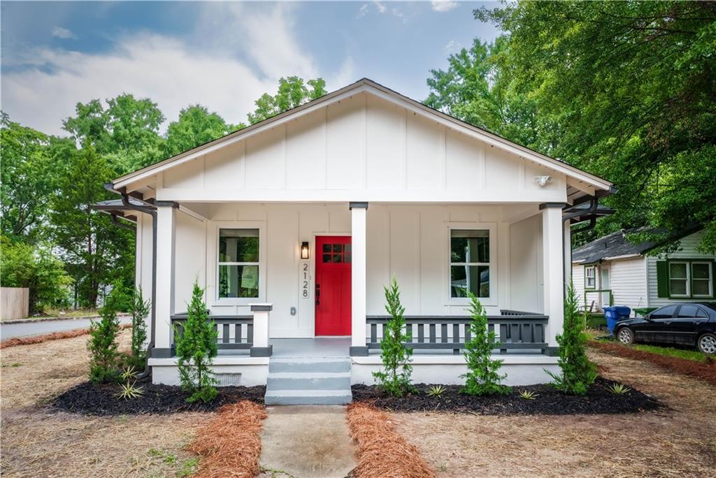 2128 Larchwood Road Southwest Atlanta, GA 30310 - Photo 1 of 1 a front view of house with a yard