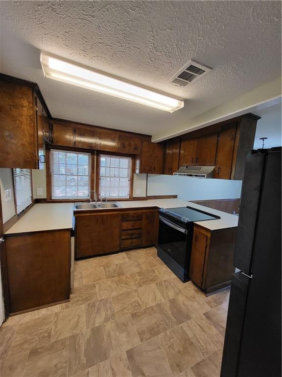 3059 Maysville Road Commerce, GA 30529 - Photo 2 of 9 a kitchen with stainless steel appliances kitchen island granite countertop a refrigerator and a stove top oven