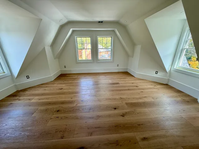 a bathroom with a sink a bathtub and next to a window