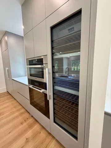 a kitchen with a refrigerator and an oven