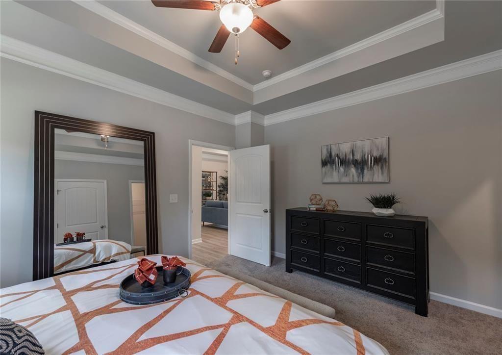 157 Red Oak Lane Calhoun, GA 30701 - Photo 11 of 18 a bedroom with a bed and wooden floor