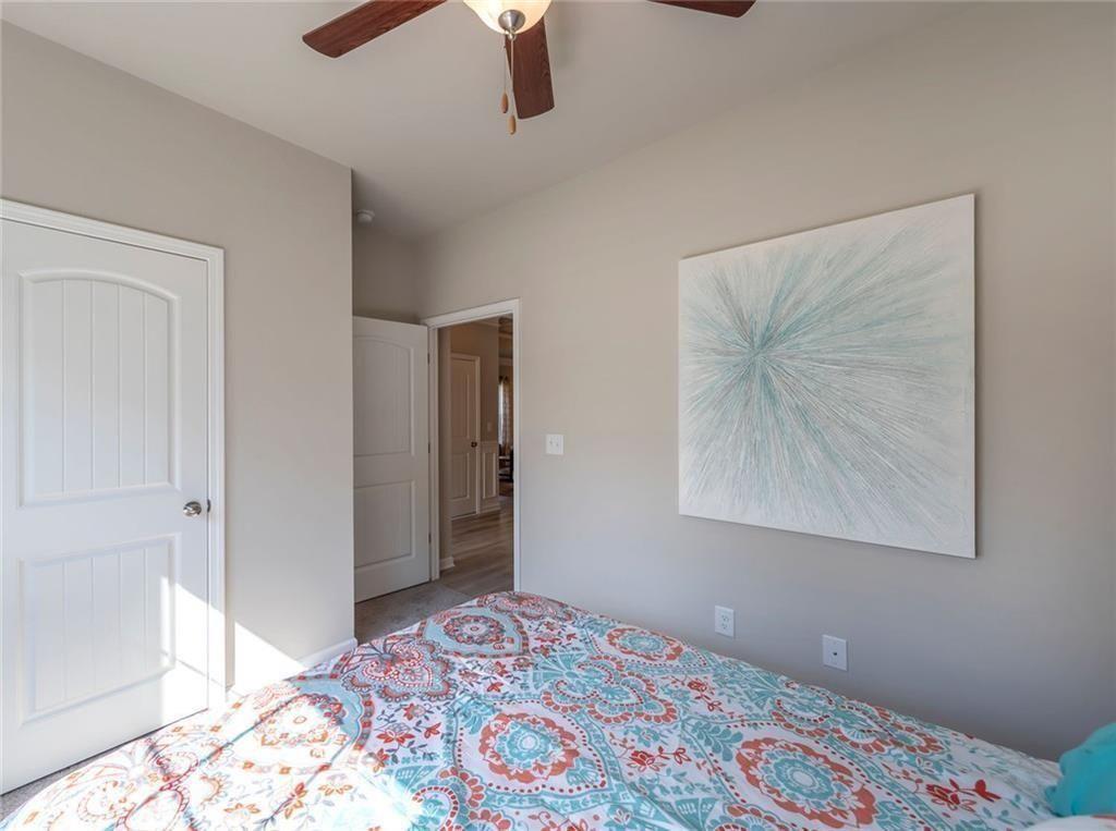 157 Red Oak Lane Calhoun, GA 30701 - Photo 13 of 18 a bedroom with a bed and a painting on the wall