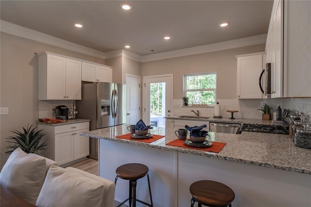 157 Red Oak Lane Calhoun, GA 30701 - Photo 7 of 18 a kitchen with a refrigerator and a sink